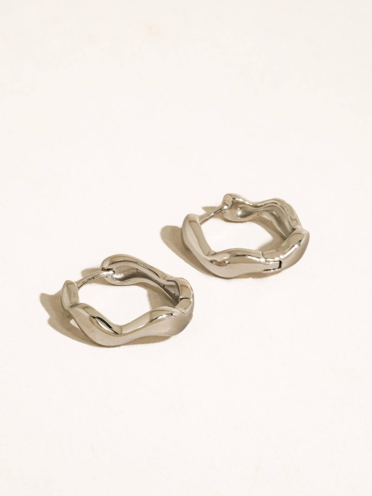 Bellac 18K Gold Non-Tarnish Wavy Hoop Earrings: Silver