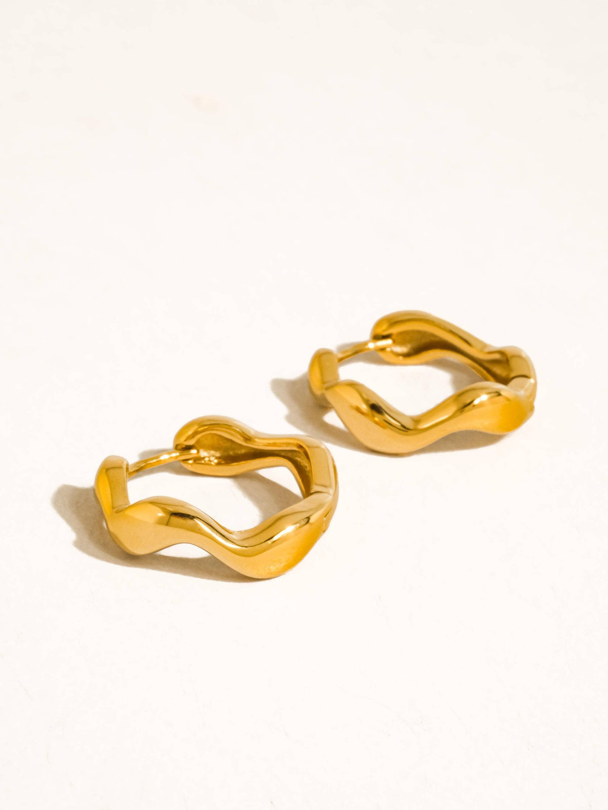 Bellac 18K Gold Non-Tarnish Wavy Hoop Earrings: Silver