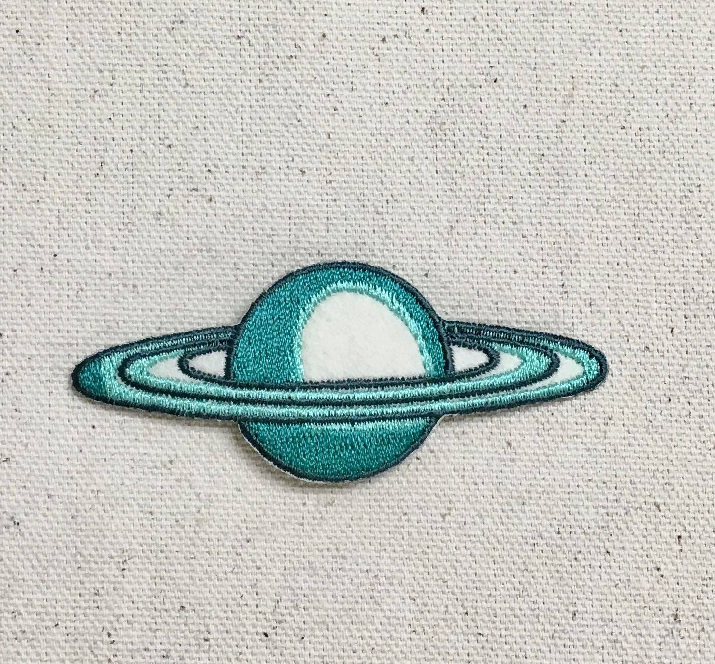 Saturn - Teal/Tan Rings - Space/Planet