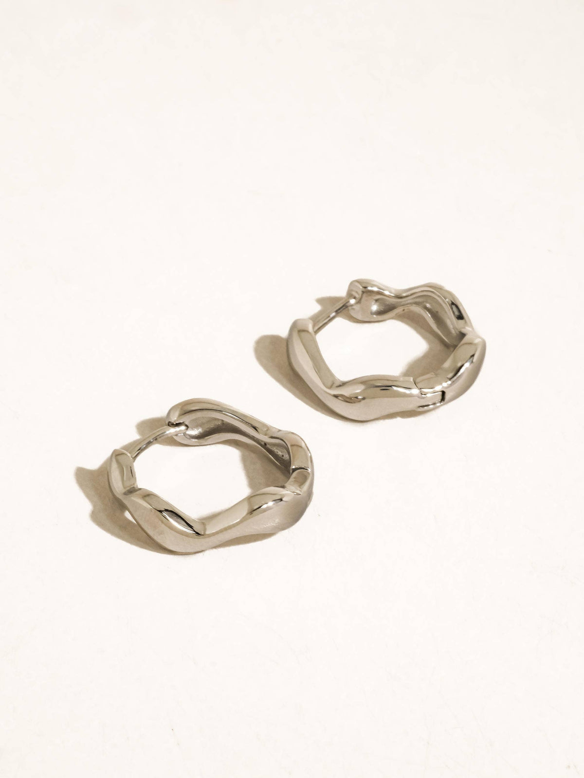 Bellac 18K Gold Non-Tarnish Wavy Hoop Earrings: Silver